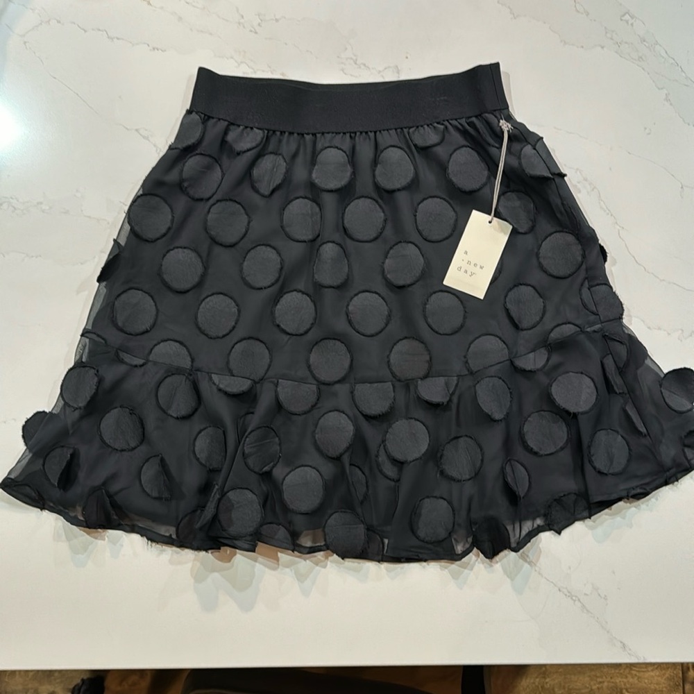 A new day. Black mini skirt